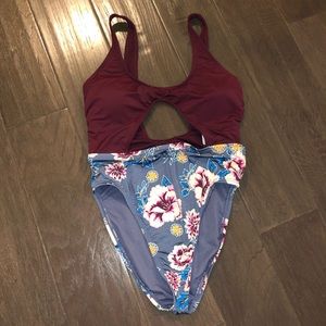 One piece bathing suit with cut out.